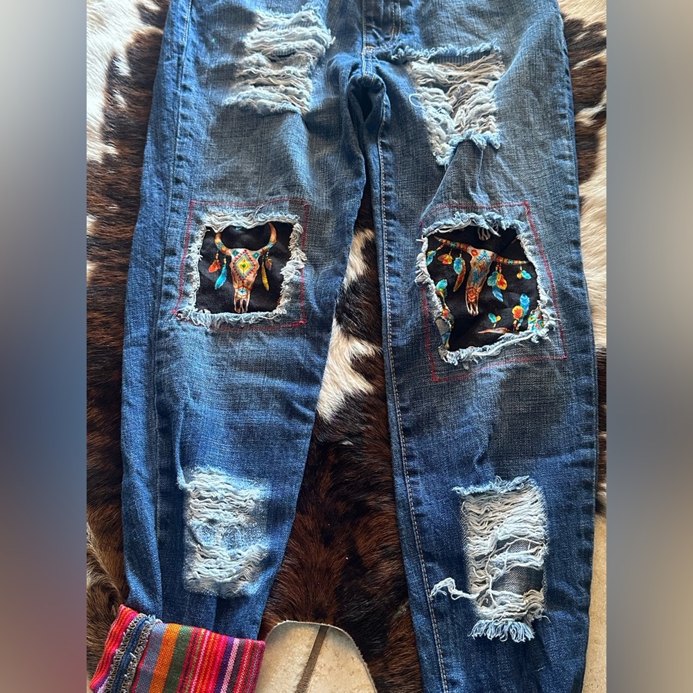 Distressed Denim Jeans with western patches and embroidery.